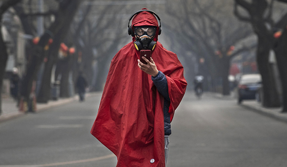 תושב עם מסכה בסין, צילום: גטי אימג