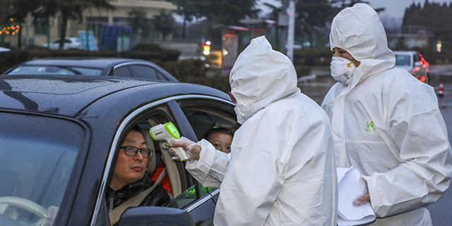 מודדים חום לנהגים ברחובות סין, צילום: איי אף פי