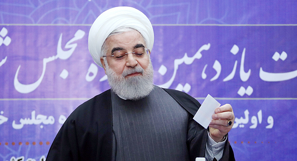 נשיא איראן חסן רוחאני. השנה צפויה להסתיים עם צמיחה שלילית של 3%