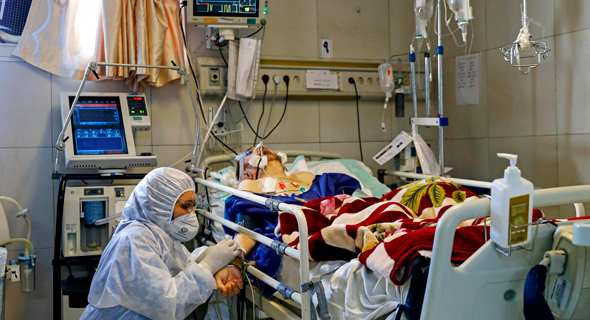 חולה קורונה בטהרן, צילום: AFP