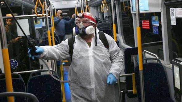 A bus in Israel getting disinfected. Photo: Motti Kimchi
