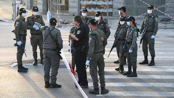 Police officers in Bnei Brak during the Covid-19 outbreak. Photo: Israel Police Spokesperson