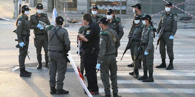 Police officers in Bnei Brak during the Covid-19 outbreak. Photo: Israel Police Spokesperson