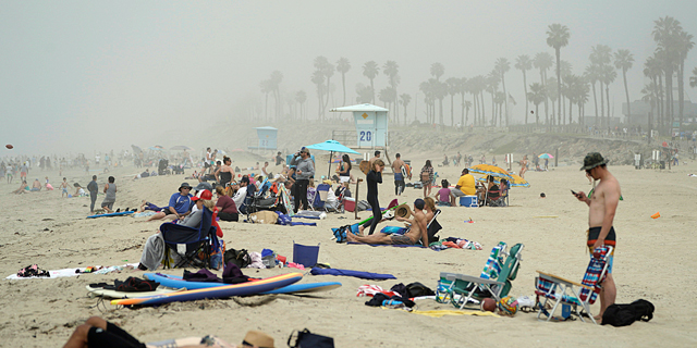 חוף היום הנטינגטון סיטי, קליפורניה, השבוע, צילום: רויטרס