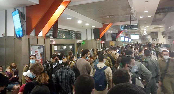 A large gathering of people in the Jerusalem Central Bus Station. Photo Souf Patishi