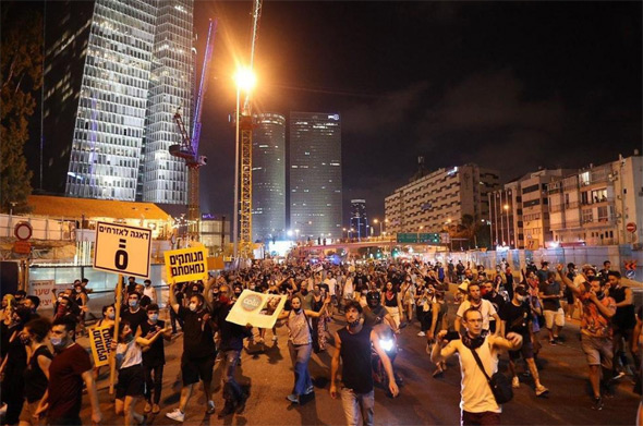 Protesters took to the streets in Tel Aviv on Saturday night. Photo: Tal Shachar
