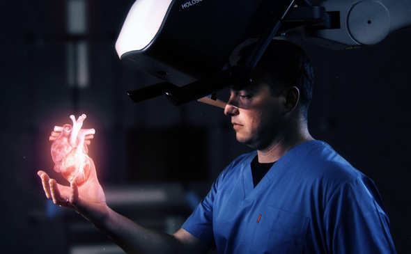 A person looking at a hologram of a human heart. Photo: RealView Imaging