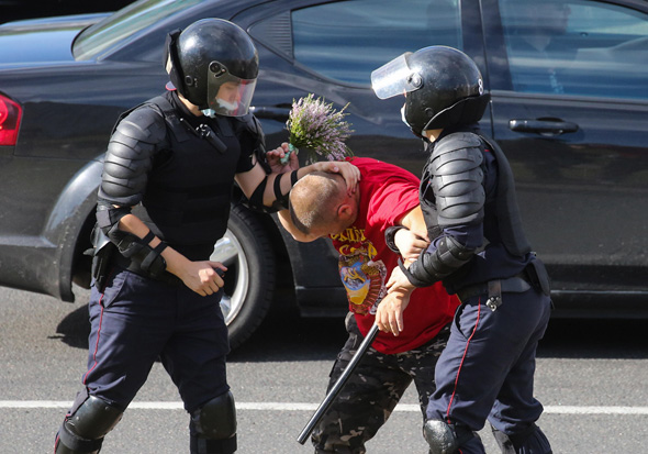 Police arrest a protester in Minsk. Photo: IPA