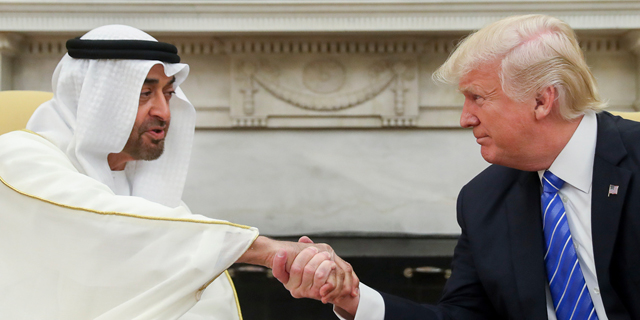 Crown Prince Mohammed bin Zayed Al Nahyan shakes hands with U.S. Prsdient Donald Trump. Photo: AP
