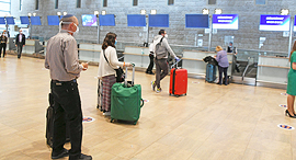 Preparing to board a flight during Covid-19 pandemic. Photo: Yair Sagi