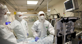 A medical team treats a person suffering from Covid-19. Photo: Reuters
