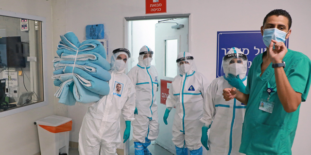 צוותי קורונה, חניון בית החולים שיבא, צילום: דנה קופל