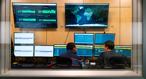 Employees at the operations center in Turin, Italy monitor satellites