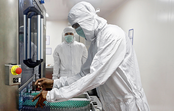 Scientists working on a Covid-19 vaccine at AstraZeneca Labs. Photo: Reuters
