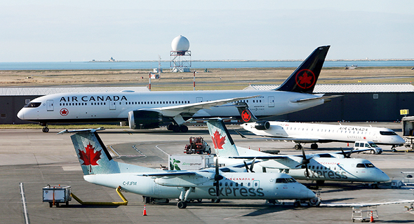 מטוסים של אייר קנדה בנמל התעופה וונקובר, צילום: רויטרס