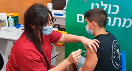A boy getting vaccinated in Israel. Photo: Ynet