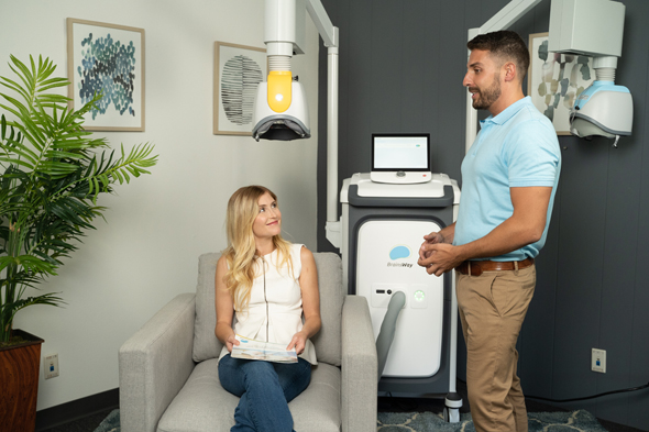 Patients who receive BrainsWay&#39;s treatment sit for an hour or two in a chair with the device affixed to their scalp (illustration). Photo: BrainsWay