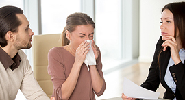 Sick people in an office. Photo: Shutterstock