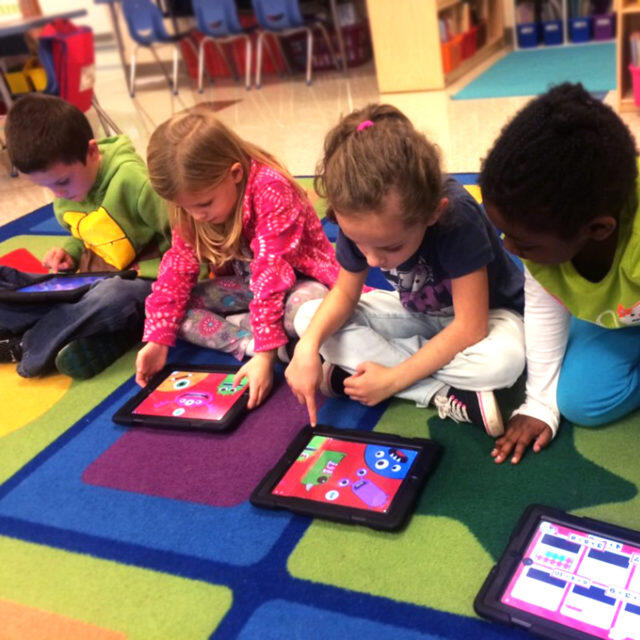 Children using TinyTap. 