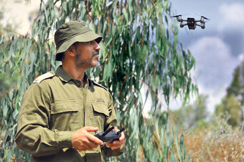 An IDF solider flying a drone. 