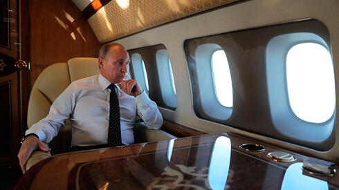 פוטין במטוסו הנשיאותי, צילום: איי אף פי