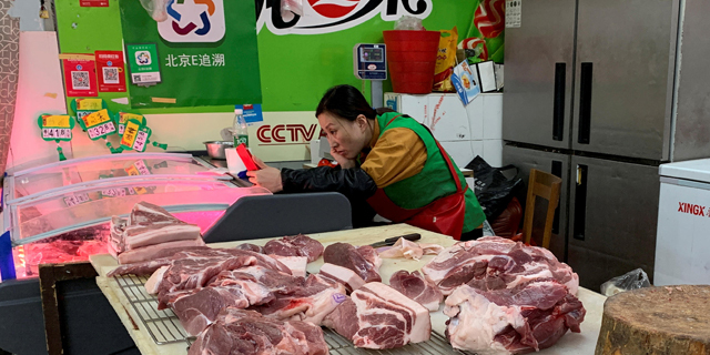 אטליז ב בייג'ינג חזירים סין 
