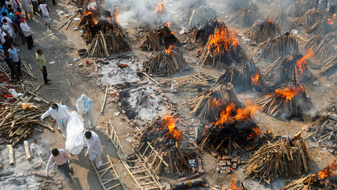 שרפה המונית של גופות בדלהי הודו, צילום: רויטרס