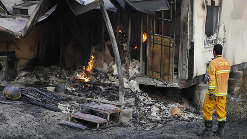 בית שנשרף בקיבוץ הראל, AFP