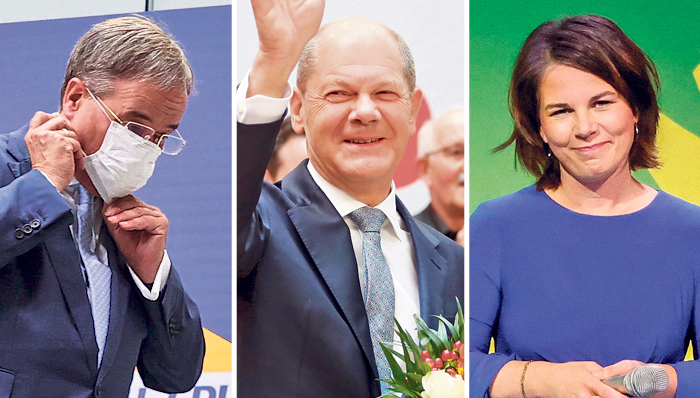 מימין מנהיגת הירוקים אנאלנה ברבוק מנהיג SPD אולף שולץ ומנהיג CDU ארמין לאשט