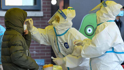 בדיקות קורונה בסין, צילום: AFP