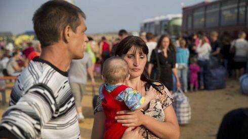 פליטים מאוקראינה. עתידים הקרוב תלוי בקריפטו, צילום: AP