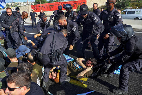 Protesters being cleared from Route 1. 