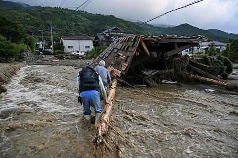 השטפונות בקורומה, יפן, צילום:  Kazuhiro NOGI / AFP