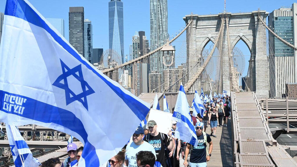 Demonstrators march across Brooklyn Bridge in support of Israeli democracy