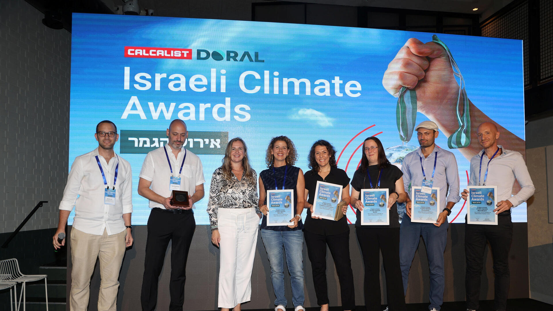 כנס Israel Climate Awards  כרזה על המיזם הזוכה בתחרות: צילום חמישיית הגמר , צילום הזוכה במקום הראשון וחלוקת המדליה