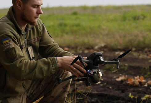 A Ukrainian soldier with a drone 