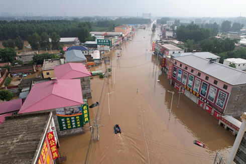 שיטפונות במחוז חביי בסין, צילום:  Jade Gao / AFP