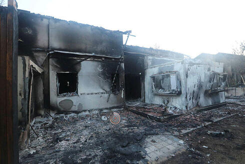 A destroyed and burned home from Hamas