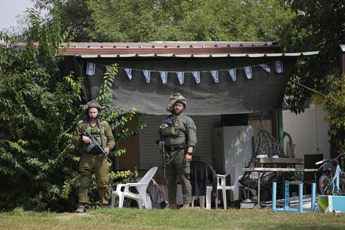 IDF soldiers in Kfar Aza. 