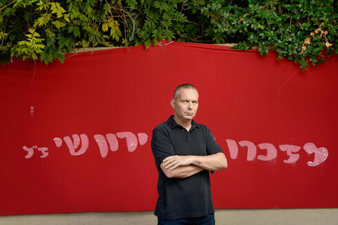 Izhar Shay in front of memorial for his son Yaron 