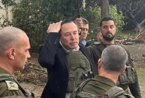 Elon Musk during a visit to Kfar Aza. 