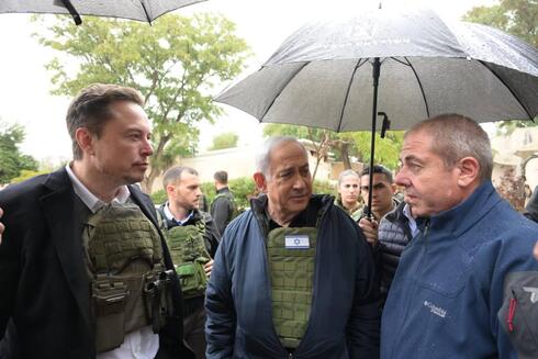 Elon Musk (left) with Benjamin Netanyahu during a visit to Kfar Aza. 