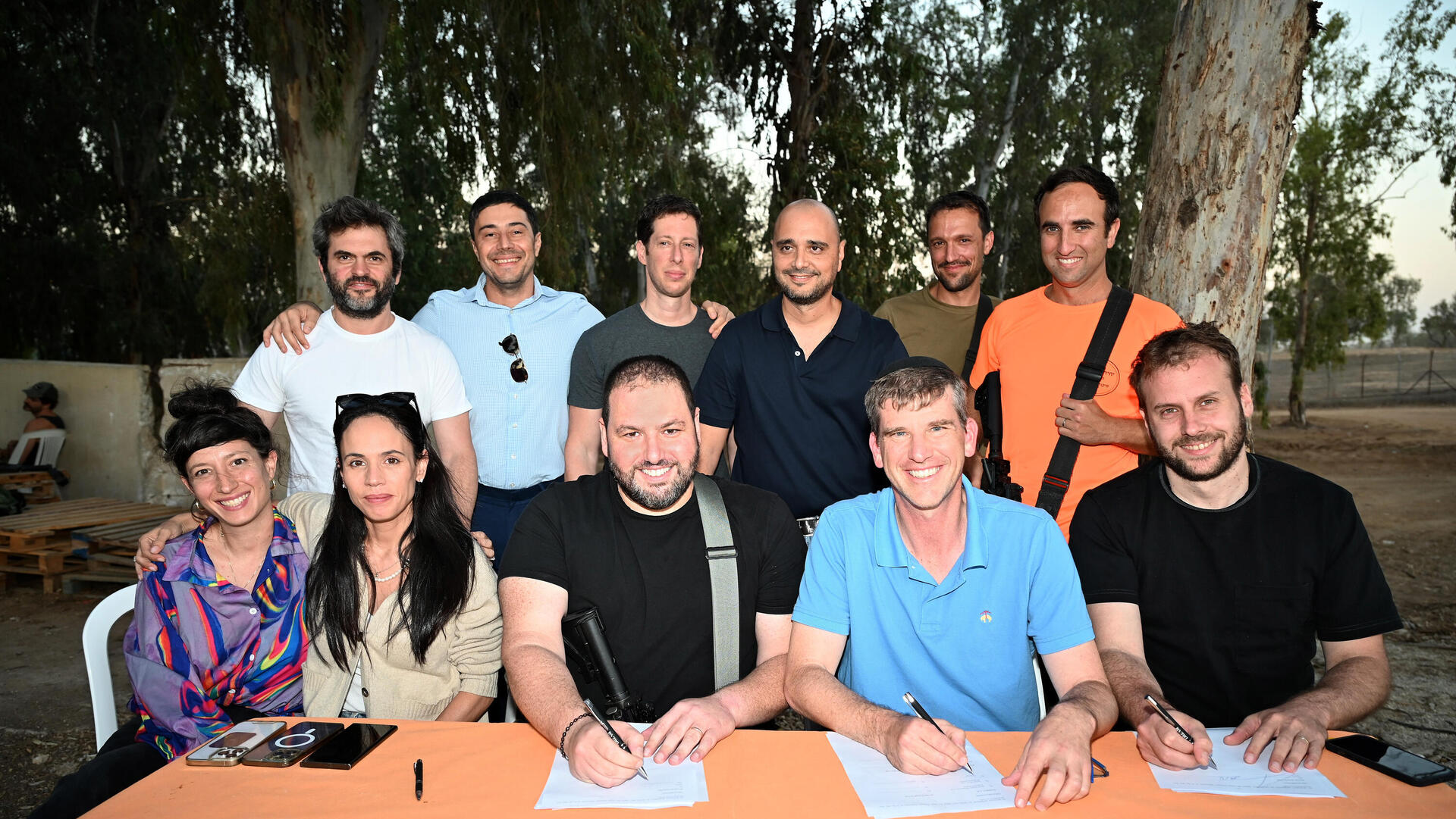 Signing the contract near the Gaza border