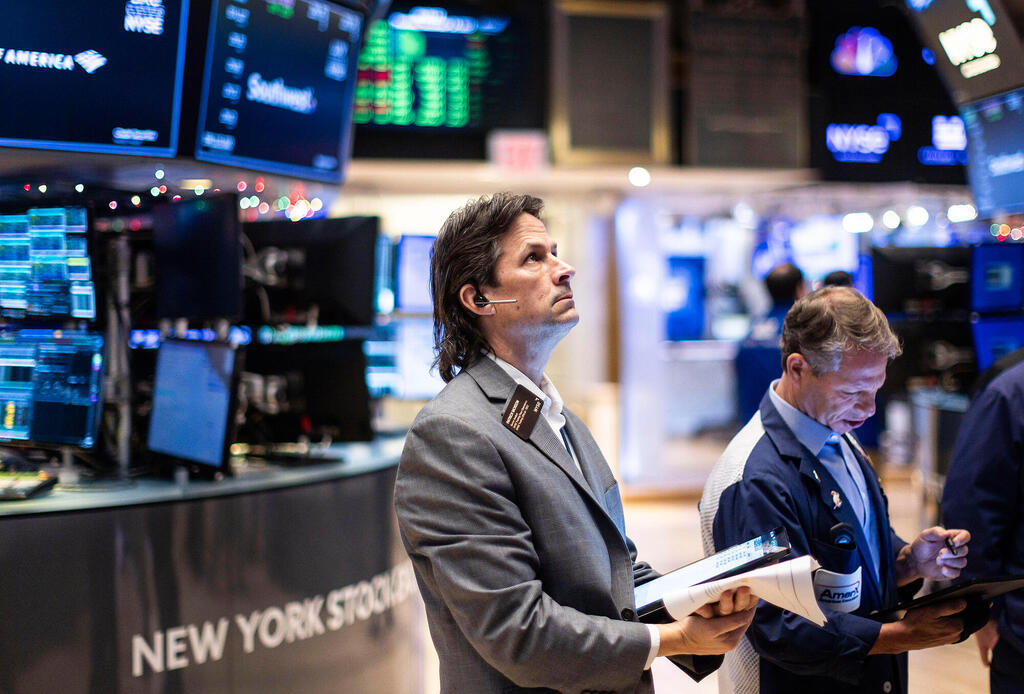 Traders on the New York Stock Exchange. (Credit: EPA/Justin Lane)