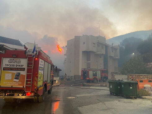 A fire in Kiryat Shmona following a Hezbollah attack. 