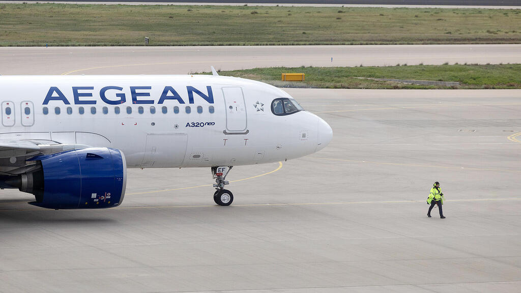 מטוס של אג'יאן איירליינס (צילום: Yorgos Karahalis/Bloomberg) 1 מטוס של חברת התעופה היוונית אג'יאן איירליינס