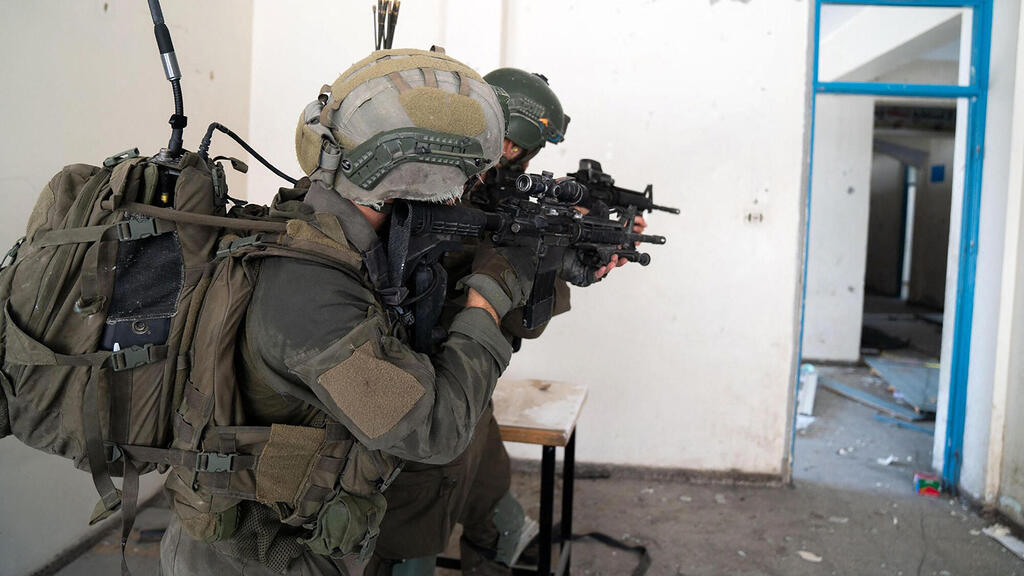 חיילים בעזה (למצולמים אין קשר לידיעה) (צילום: ISRAELI ARMY / AFP) חיילים ב עזה