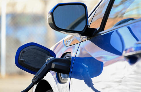Electric car being charged. 