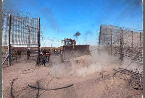 Hamas tractor breaching the Israel border with Gaza.