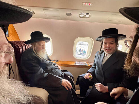 Yoeli Landau <span style="font-weight: normal;">(right)</span> on his private jet with Rebbe of Gur Yoeli Landau <span style="font-weight: normal;">(right)</span> on his private jet with Rebbe of Gur